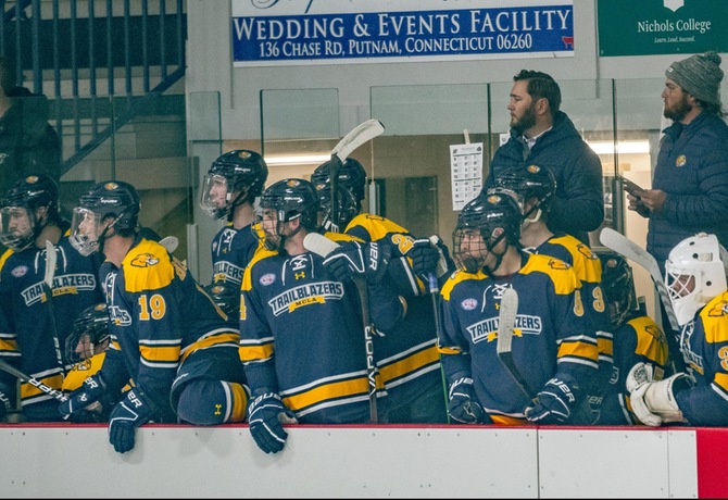 The MCLA Mens Hockey team preparing to make substitutions during a game at UMass Dartmouth (via MCLA Athletics).