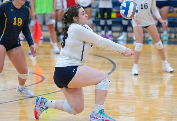 An MCLA Lady Trailblazer in action during their match-up with Castleton University. 