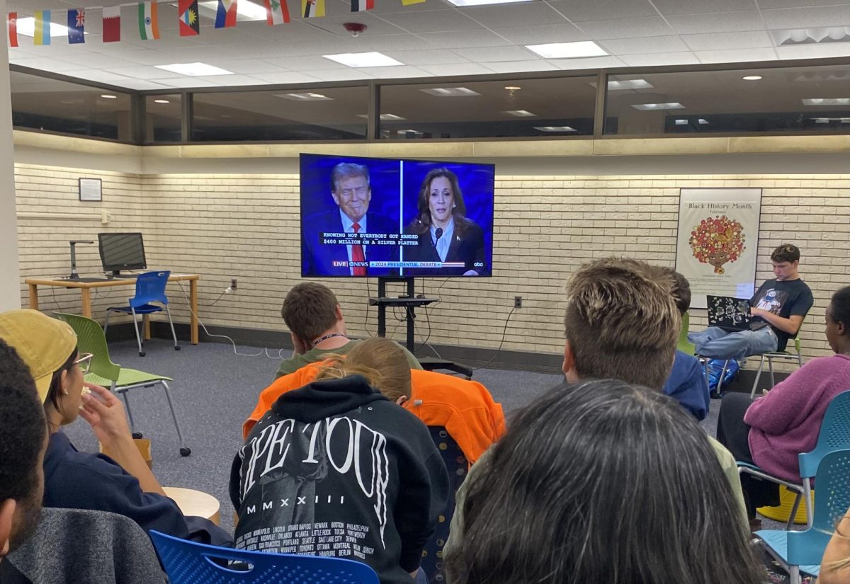 Students view the live presidential debate inside MCLA's Freel Library