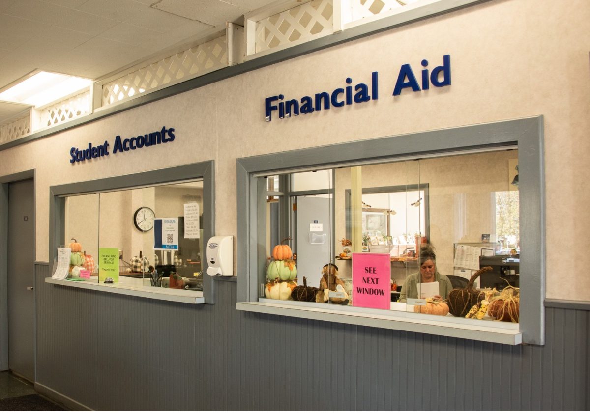 Student Financial Services Clerk, Becky Lincoln, processes paperwork at MCLA’s SFS office in Eldridge Hall. 