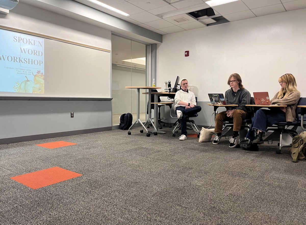 Poetry Collective co-founder and president Matt Lewellyn listens to spoken word poetry at the club's workshop on Oct. 29th. 