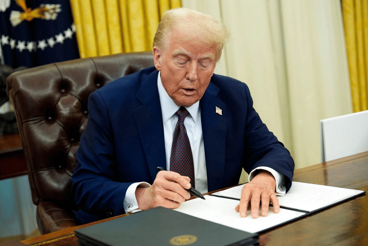 President Trump signs executive orders on January 22, 2025, to roll back federal diversity, equity, and inclusion policies. 