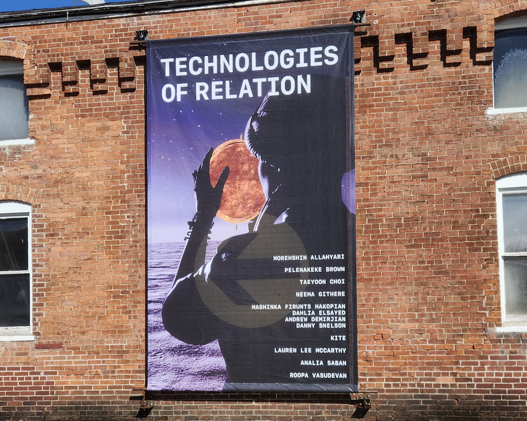 Banner for the Technologies of Relation exhibition displayed at MassMoCA in North Adams, Massachusetts.